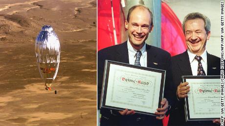 Left: The Breitling Orbiter III balloon flies over the dunes of the desert of western Egypt, March 21 1999 before landing after its round the world flight. Right: Bertrand Piccard and Brian Jones hold certificates honoring their historic balloon flight during ceremonies at the Smithsonian National Air and Space Museum in Washington, DC.