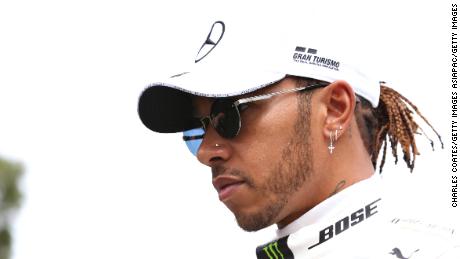 MELBOURNE, AUSTRALIA - MARCH 12: Lewis Hamilton of Great Britain and Mercedes GP walks in the Paddock during previews ahead of the F1 Grand Prix of Australia at Melbourne Grand Prix Circuit on March 12, 2020 in Melbourne, Australia. (Photo by Charles Coates/Getty Images)