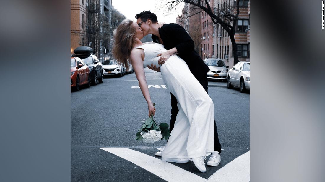 Couple shouts 'I do' as friend officiates wedding from his fourth-floor window