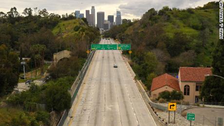 Extremely light traffic moves along the 110 Harbor Freeway toward downtown mid afternoon, Friday, March 20, 2020, in Los Angeles. Traffic would normally be bumper-to-bumper during this time of day on a Friday. California Gov. Gavin Newsom is ordering the state&#39;s 40 million residents to stay at home indefinitely. His order restricts non-essential movements to control the spread of the coronavirus that threatens to overwhelm the state&#39;s medical system. He called up 500 National Guard troops Thursday to help with distributing food. (AP Photo/Mark J. Terrill)