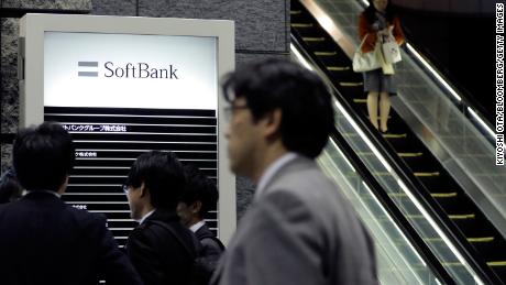 Pedestrians walking past SoftBank Group headquarters in Tokyo in 2018.