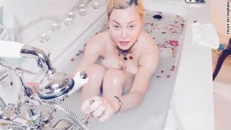 Coronavirus is 'the great equalizer,' Madonna tells fans from her bathtub