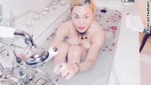 Coronavirus is &apos;the great equalizer,&apos; Madonna tells fans from her bathtub