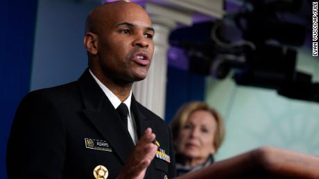 Surgeon General Jerome Adams speaks during press briefing with the coronavirus task force, at the White House, Thursday, March 19, 2020, in Washington. White House coronavirus response coordinator Dr. Deborah Birx listens at right. (AP Photo/Evan Vucci)