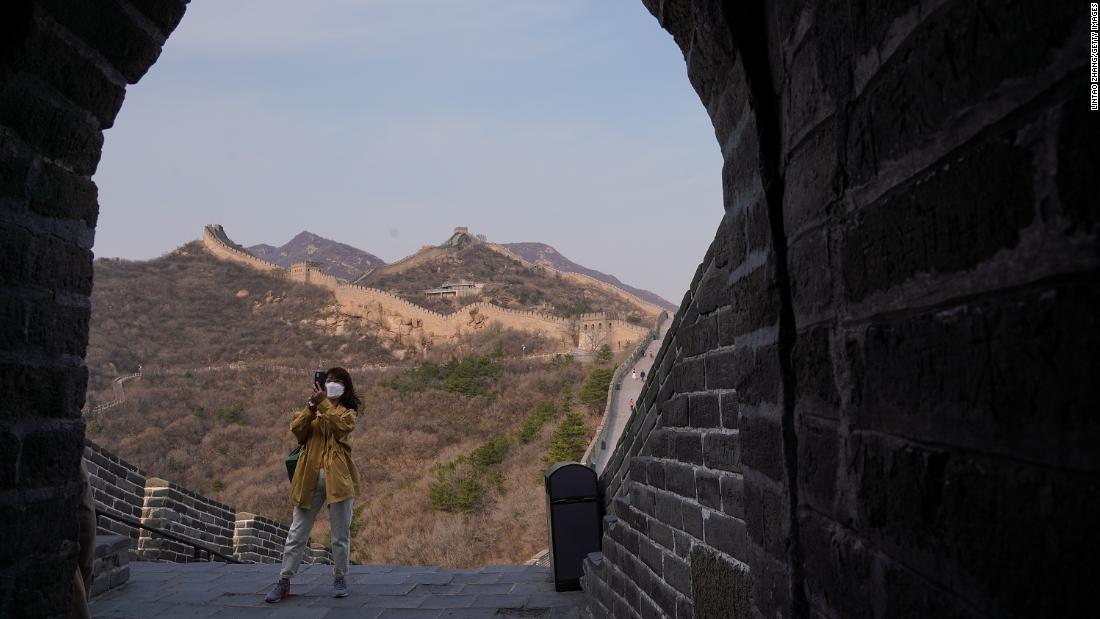 A tourist wears a face mask while visiting the Badaling section of the Great Wall of China on March 24, 2020. The section &lt;a href=&quot;https://www.cnn.com/travel/article/badaling-great-wall-china-reopens-intl-hnk/index.html&quot; target=&quot;_blank&quot;&gt;reopened&lt;/a&gt; to visitors after being closed for two months.