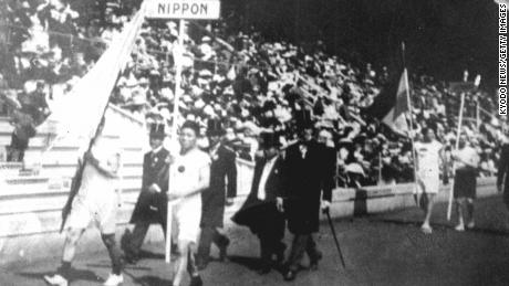 The Japanese athletic delegation marches during the opening ceremony of the 1912 Olympic Games in Stockholm, Sweden, which marked Japan&#39;s first Olympic appearance. The sign holder was marathon runner Shiso Kanaguri (R front) and the flag bearer was sprinter Yahiko Mishima (L front). (Photo by Kyodo News Stills via Getty Images)