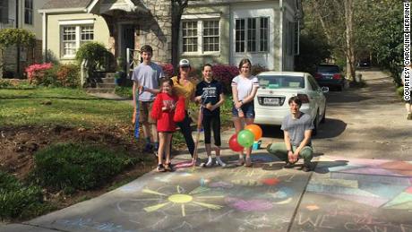 About a dozen families came together to do something special at each stop on 16-year-old Carrie Crespino&#39;s birthday walk through her Decatur, Georgia neighborhood.