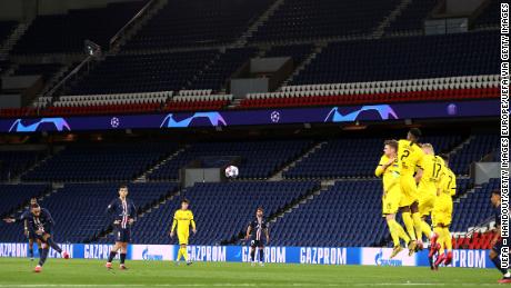 Neymar of Paris Saint-Germain takes a freekick during the UEFA Champions League round of 16 second leg match against Borussia Dortmund that was played behind closed doors as a precaution against the spread of Coronavirus.