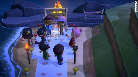 Sharmin Asha and Nazmul Ahmed gather for a virtual wedding in Nintendo&#39;s &quot;Animal Crossing,&quot; surrounded by friends.