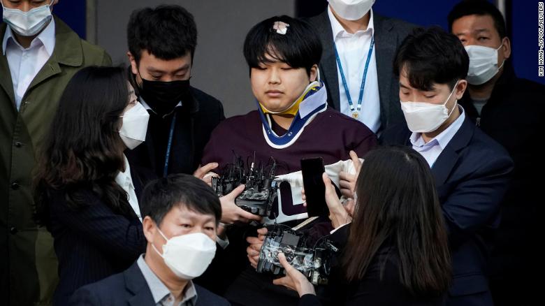 Cho Ju-bin, who allegedly ran an online sexual blackmail ring, walks out of a police station as he is transferred to a prosecutor&#39;s office in Seoul, South Korea, on March 25.  