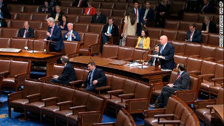House members sit spaced apart as Rep. Kevin McCarthy, left, speaks, in an image taken from video. 