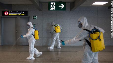 Members of the Military Emergencies Unit (UME) carry out a general disinfection at Malaga airport on March 16, 2020. 