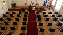 Groom Gyorgy David Jablonovszky and his bride Timea Jablonovszky sit, along with close relatives, during their wedding ceremony on Saturday, March 28, at the town hall in Miskolc, Hungary.