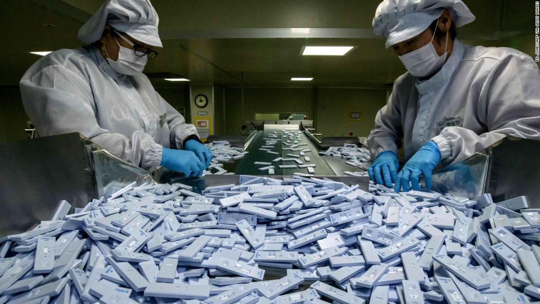 Devices used in diagnosing the coronavirus are inspected in Cheongju, South Korea, on March 27, 2020. The devices were being prepared for testing kits at the bio-diagnostic company SD Biosensor.