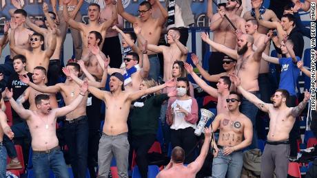 Fans of FC Minsk support their team during the Belarus Championship foolball match between FC Minsk and FC Dinamo-Minsk in Minsk, on March 28, 2020. - In stark contrast to leagues elsewhere on the European continent, the Belarus championship continues. (Photo by Sergei GAPON / AFP) (Photo by SERGEI GAPON/AFP via Getty Images)