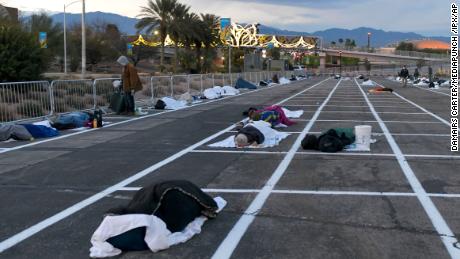 People rest at a temporary homeless shelter at Cashman Center in Las Vegas on Sunday, March 29.