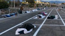 People rest at a temporary homeless shelter at Cashman Center in Las Vegas on Sunday, March 29.