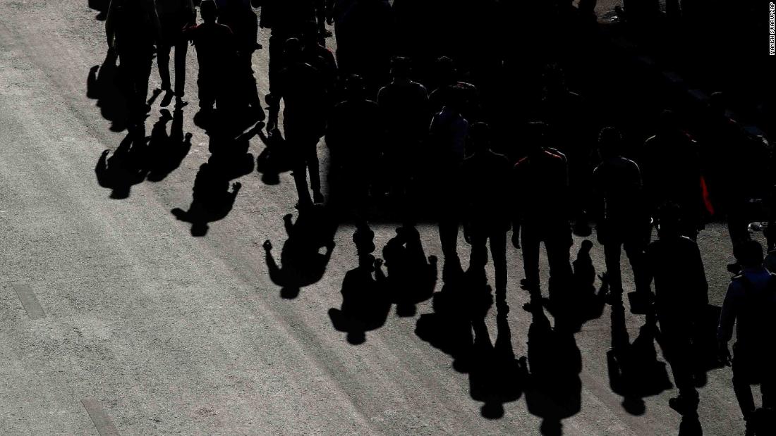 Migrant workers walk home from New Delhi.