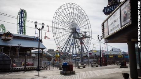 Amusement rides stand idle near an empty boardwalk in Seaside Heights, New Jersey, on Friday.