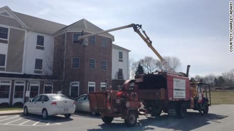 A son used a bucket truck to visit his mother on the third floor of her assisted living home