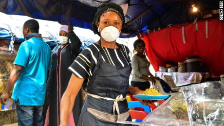 A food seller in Abuja, Nigeria's capital tells CNN she cannot afford to stay at home. Picture by Osaze Efe. 