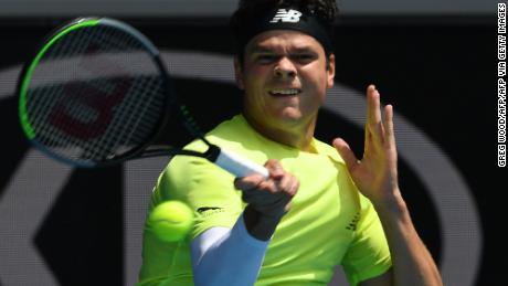 Canada&#39;s Milos Raonic hits a return against Croatia&#39;s Marin Cilic during their men&#39;s singles match on day seven of the Australian Open tennis tournament in Melbourne on January 26, 2020. (Photo by Greg Wood / AFP) / IMAGE RESTRICTED TO EDITORIAL USE - STRICTLY NO COMMERCIAL USE (Photo by GREG WOOD/AFP via Getty Images)