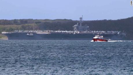 Sailors cheer for aircraft carrier commander who was removed after issuing coronavirus warning 