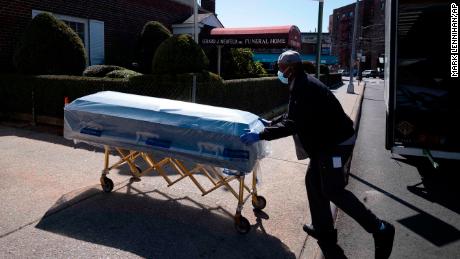 William Samuels delivers caskets to the Gerard Neufeld Funeral Home in the Queens borough of New York City on Friday, March 27, 2020.