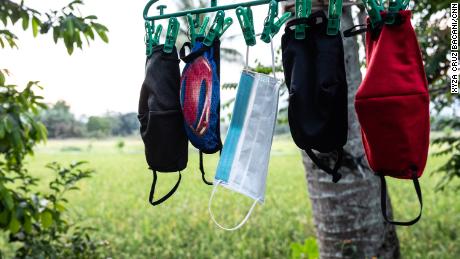 April Abrias&#39; facemasks are hung out to dry after being washed so they can be reused.