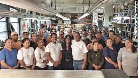 The employees of Pietro Handbags pose for a photo in their factory in New York City.