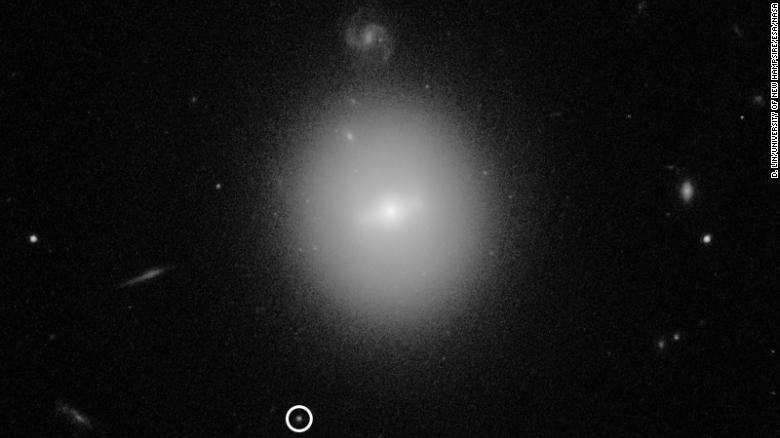 This is a Hubble image of the black hole, indicated by the white circle.