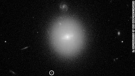 This is a Hubble image of the black hole, indicated by the white circle.