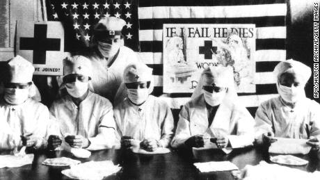 Red Cross volunteers wore face masks during the flu pandemic of 1918.