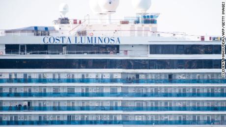 Costa Luminosa passengers  are seen as the ship is moored in the harbor in Marseille, France.