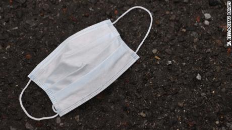 MERRICK, NEW YORK - MARCH 31:  A used mask lies outside of Pat's Farms grocery store on March 31, 2020 in Merrick, New York. Since the coronavirus pandemic people have been discarding used masks on the ground rather than dispensing them in the trash. The World Health Organization declared coronavirus (COVID-19) a global pandemic on March 11.  (Photo by Al Bello/Getty Images)