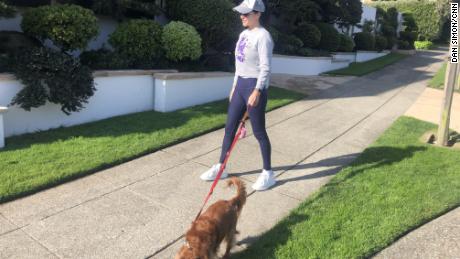 Simon&#39;s wife Katherine makes sure to stay more than 6 feet away from anyone she sees out while walking the family dog, Coco.