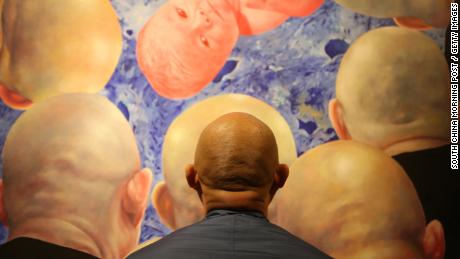 With hair loss on the rise, Asia's men grapple with what it means to be bald