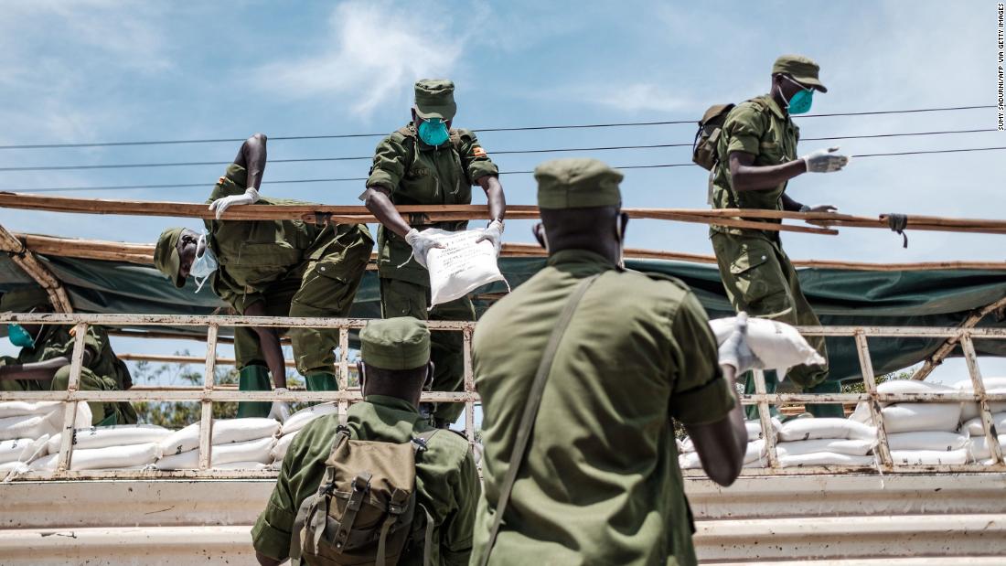 Paramilitary members unload provisions in Kampala, Uganda, on April 4, 2020. It was the first day of government food distribution for people affected by the nation&#39;s lockdown.