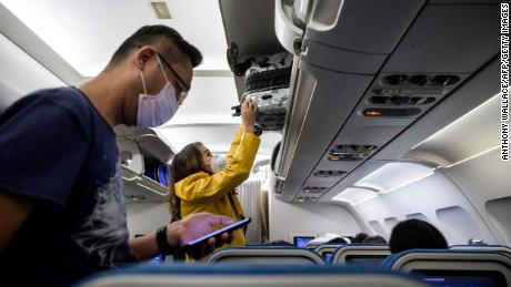 How risky is it to fly during a pandemic?  What we know and how to make it safer