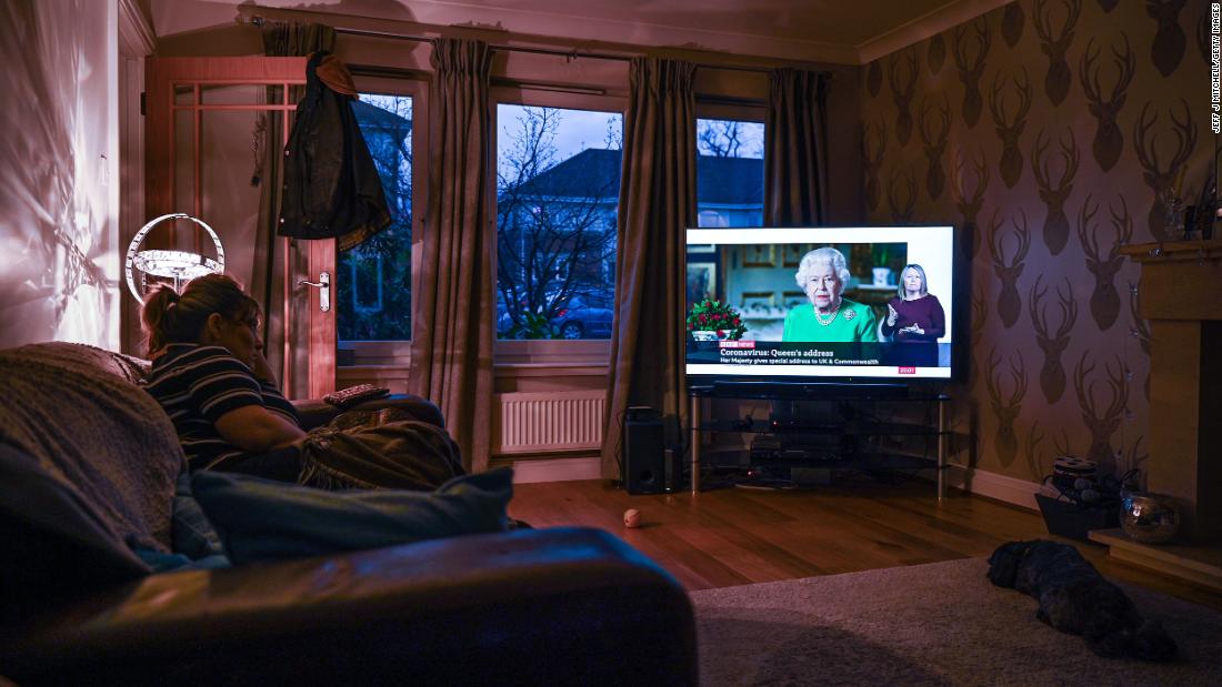 A woman in Glasgow, Scotland, watches Britain&#39;s Queen Elizabeth II &lt;a href=&quot;http://www.cnn.com/2020/04/05/uk/queen-elizabeth-ii-coronavirus-address-gbr-intl/index.html&quot; target=&quot;_blank&quot;&gt;give a television address&lt;/a&gt; regarding the coronavirus pandemic.