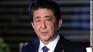 Japan&#39;s Shinzo Abe promotes anti-flu drug to treat virus