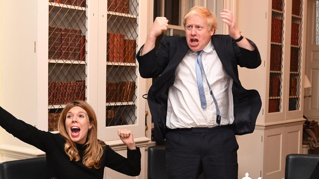 Johnson and his partner, Carrie Symonds, react to election results from his study at No. 10 Downing Street.