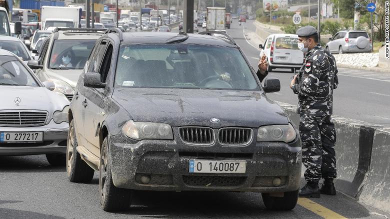 Lebanese security forces stop cars at a highway checkpoint north of Beirut on April 6, as authorities implemented further measures restricting the movement of vehicles.