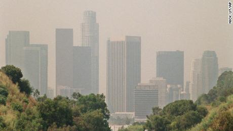 HOLD FOR STORY - FILE - In this July 1998 file photo, traffic drives toward downtown Los Angeles on the 110 freeway as a curtain of smog shrouds the skyline. Southern California is having its smoggiest summer in nearly a decade and hospitals report an increase of people with breathing problems. The South Coast Air Quality Management District says ozone levels exceeded federal standards for all but four days in June 2016. July had only one clean-air day, and there hasn&#39;t been a single day so far in August. The worst-hit areas are in the mountains and inland areas outside of Los Angeles. (AP Photo/Nick Ut, File)