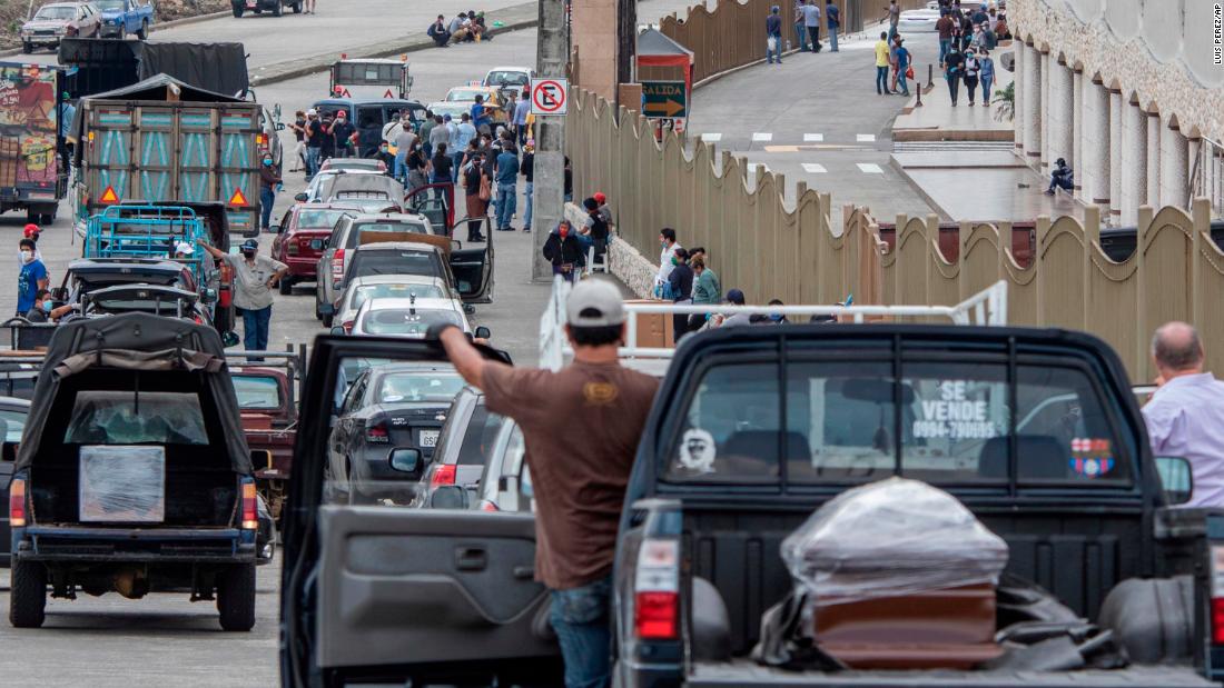 People wait in line to bury loved ones at a cemetery in Guayaquil, Ecuador, on April 6. In some parts of the &lt;a href=&quot;http://edition.cnn.com/2020/04/03/americas/guayaquil-ecuador-overwhelmed-coronavirus-intl/index.html&quot; target=&quot;_blank&quot;&gt;overwhelmed city,&lt;/a&gt; bodies have been left on the streets. 