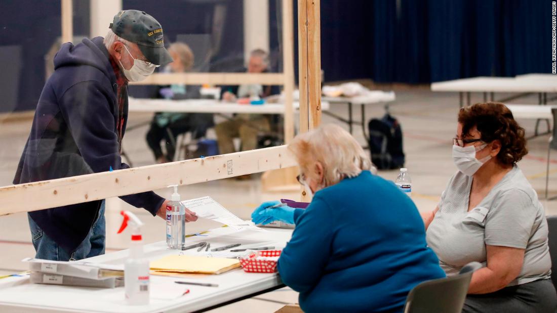 A voter checks in to cast a ballot in Kenosha, Wisconsin, on April 7, 2020. The state was going through with &lt;a href=&quot;https://www.cnn.com/2020/04/07/politics/wisconsin-primary-coronavirus/index.html&quot; target=&quot;_blank&quot;&gt;its presidential primary&lt;/a&gt; despite the pandemic.