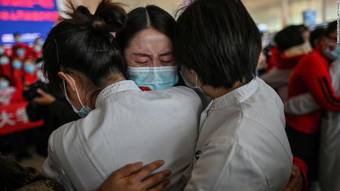 A medical staff member from China&#39;s Jilin province, center, cries while hugging nurses from Wuhan on April 8, 2020. Wuhan was &lt;a href=&quot;https://www.cnn.com/2020/04/07/asia/coronavirus-wuhan-lockdown-lifted-intl-hnk/index.html&quot; target=&quot;_blank&quot;&gt;reopening its borders&lt;/a&gt; after 76 days.