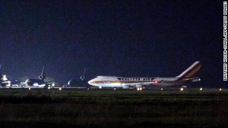 A plane carrying American passengers released from the Diamond Princess cruise ship in Japan arrives at Travis Air Force Base in California on Feb. 16, 2020. 