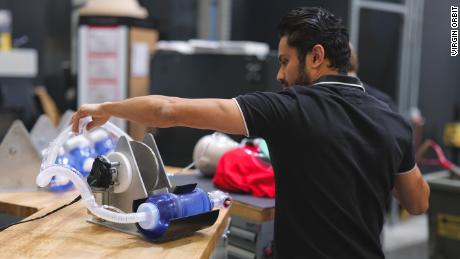 Engineer Vishal Doshi runs tests on an early prototype of a bridge ventilator in Virgin Orbit&#39;s Long Beach, California lab. 