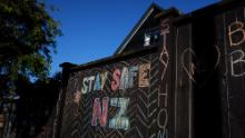 A house fence chalked up with messages relating to the Covid-19 lockdown on April 3, 2020 in Auckland, New Zealand. 